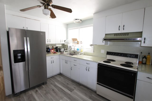 kitchen with electric range, stainless steel fridge with ice dispenser, range hood, light countertops, and a sink