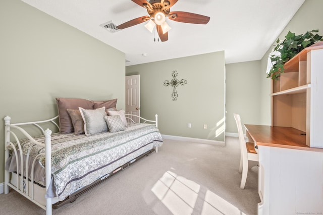 bedroom with baseboards, visible vents, a ceiling fan, and light colored carpet