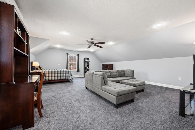 bedroom featuring lofted ceiling, baseboards, dark colored carpet, and a textured ceiling