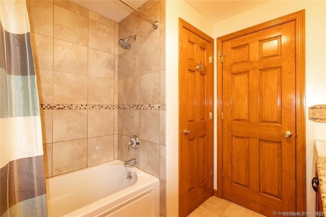 bathroom featuring shower / tub combo and tile patterned flooring