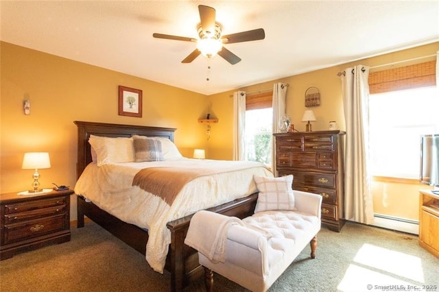 bedroom with a ceiling fan, light carpet, and baseboard heating