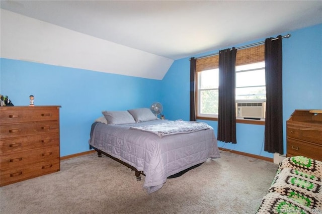 bedroom featuring baseboards, vaulted ceiling, cooling unit, and carpet flooring