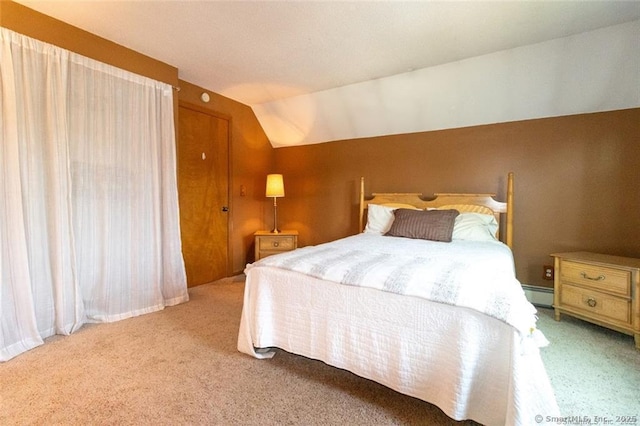 carpeted bedroom featuring lofted ceiling and baseboard heating