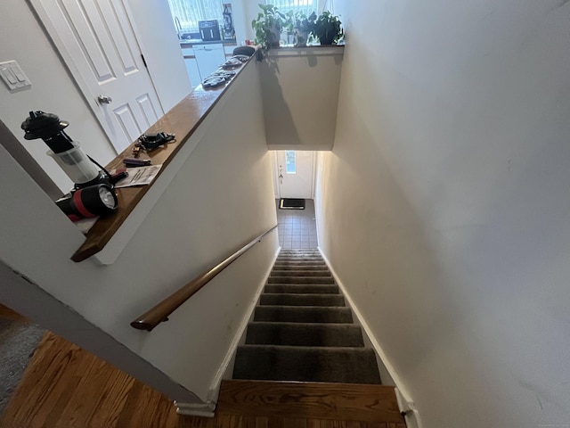 stairway featuring baseboards