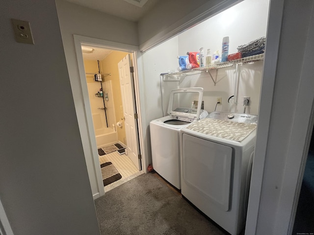 washroom with carpet floors, laundry area, and washer and clothes dryer