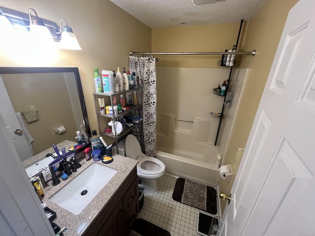 full bathroom featuring shower / tub combo, toilet, tile patterned flooring, a textured ceiling, and vanity