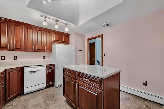 kitchen with a baseboard radiator, light stone countertops, white appliances, visible vents, and a center island