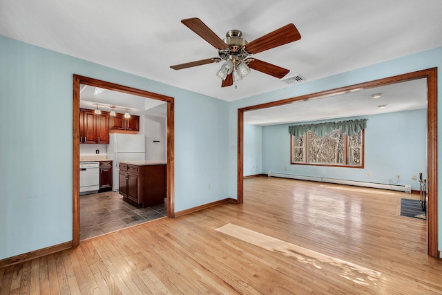 unfurnished living room featuring light wood finished floors, baseboards, visible vents, ceiling fan, and baseboard heating