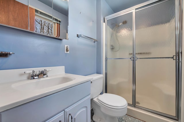 full bathroom with toilet, a stall shower, and vanity