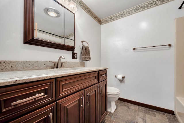 full bathroom with baseboards, a shower, toilet, a bathing tub, and vanity