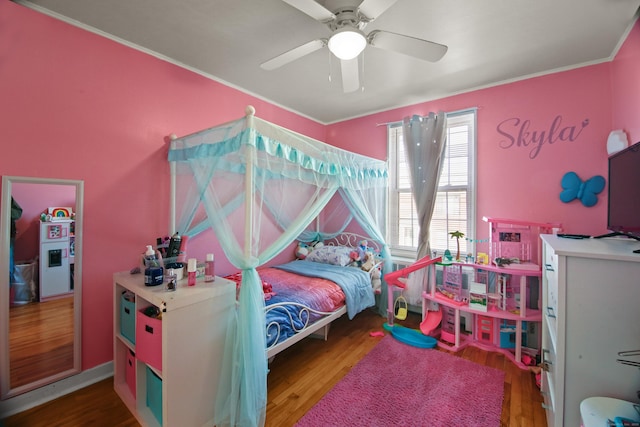 bedroom featuring a ceiling fan and wood finished floors