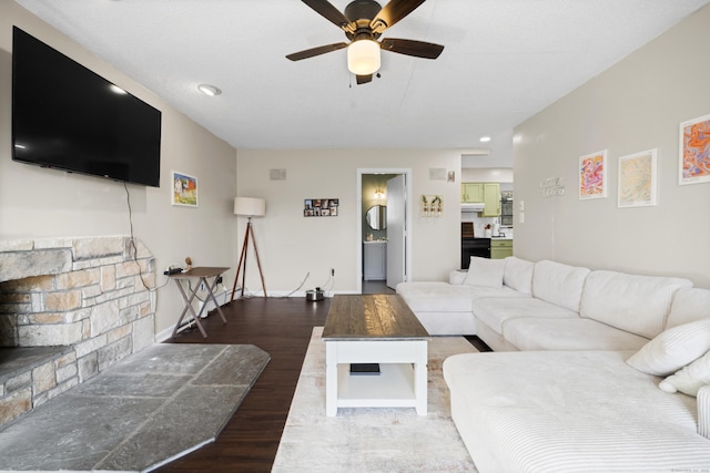 living room featuring ceiling fan and wood finished floors