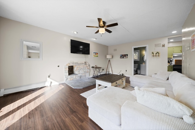 living room with a ceiling fan, wood finished floors, recessed lighting, a fireplace, and a baseboard radiator