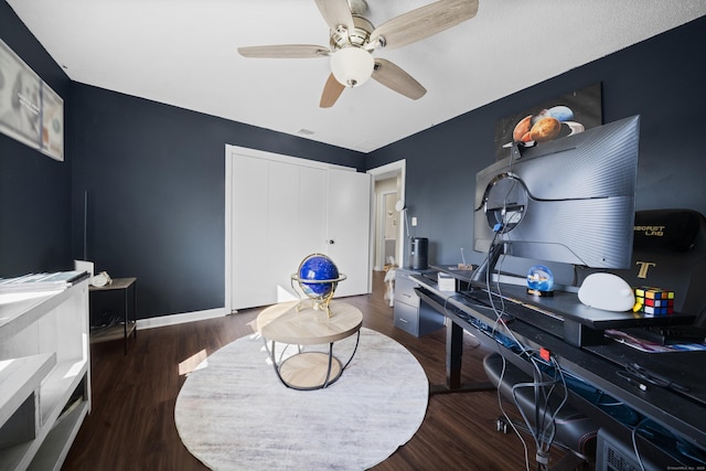 office space featuring visible vents, baseboards, wood finished floors, and a ceiling fan