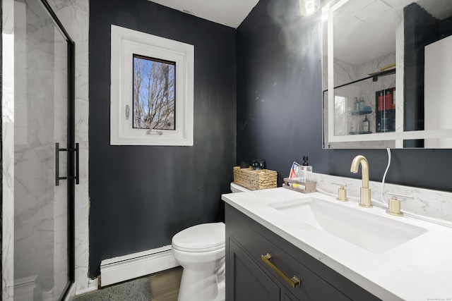 bathroom with a marble finish shower, a baseboard heating unit, and toilet