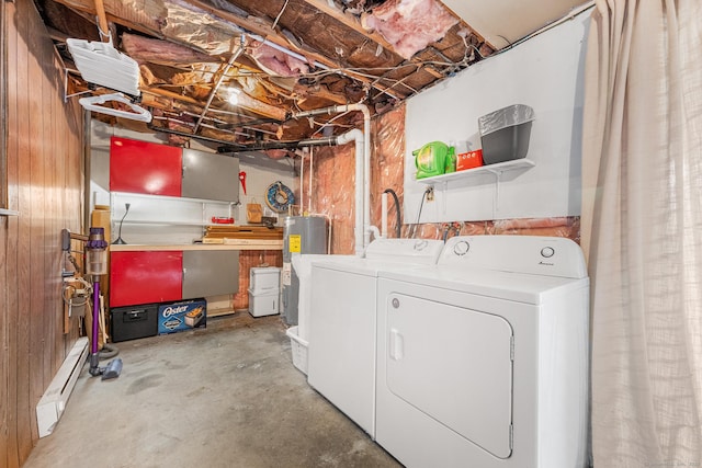 laundry room with a baseboard heating unit, laundry area, electric water heater, and independent washer and dryer