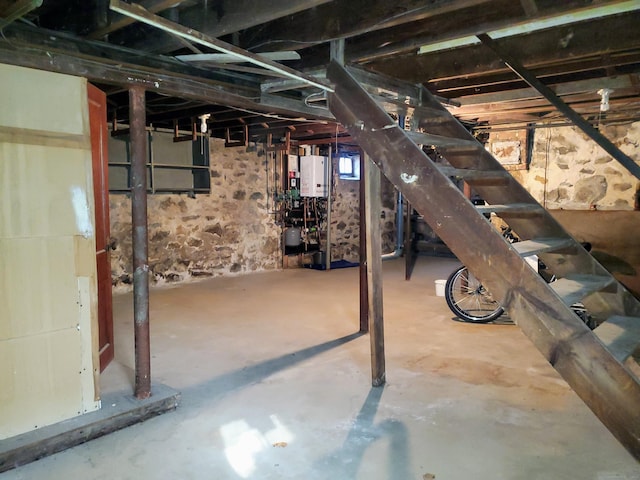 unfinished basement with water heater