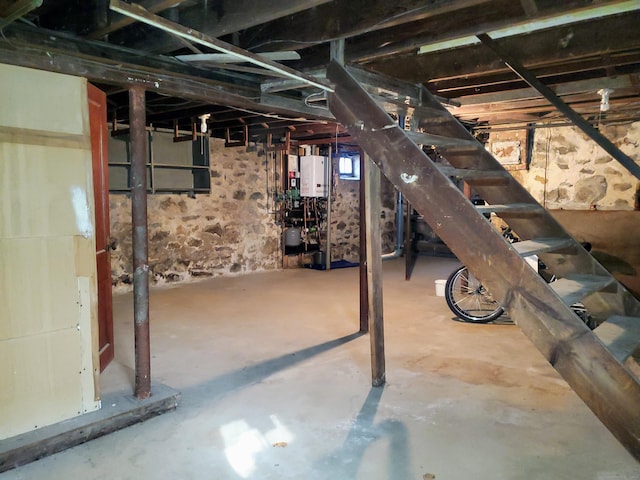 14 Sycamore St, Norwalk, CT 06855 - unfinished basement featuring tankless water heater and stairway