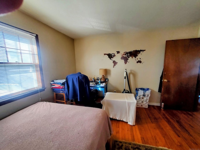 bedroom featuring wood finished floors