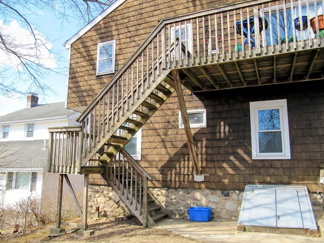 exterior space featuring stairs and crawl space