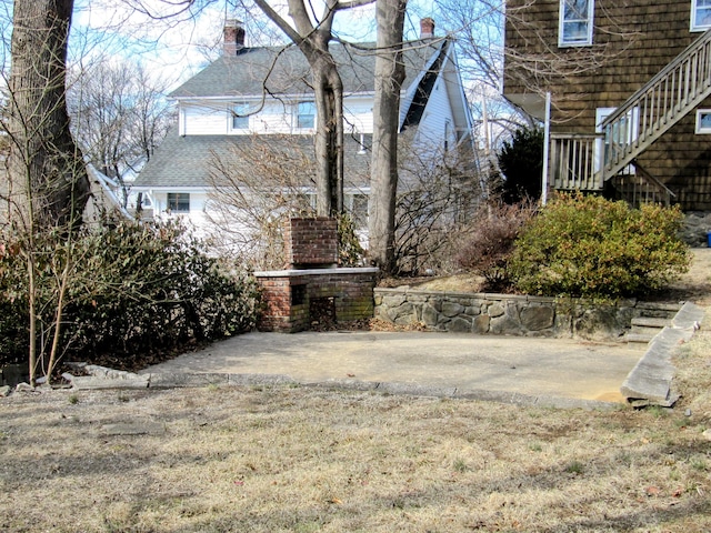 14 Sycamore St, Norwalk, CT 06855 - view of yard featuring exterior fireplace and stairway