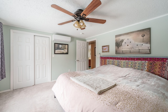 bedroom featuring crown molding, a textured ceiling, carpet flooring, and a wall mounted AC