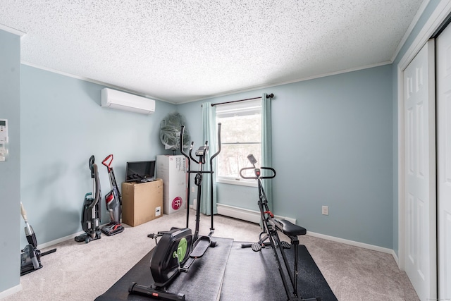 exercise area with a textured ceiling, carpet floors, a wall unit AC, and crown molding