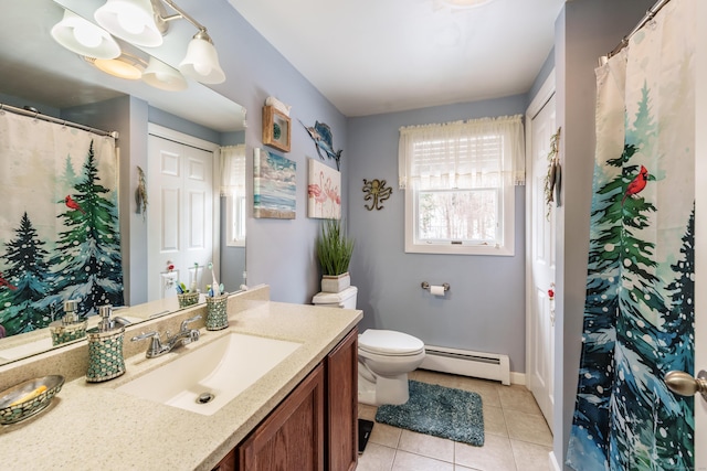 bathroom featuring a baseboard radiator, vanity, toilet, and tile patterned floors