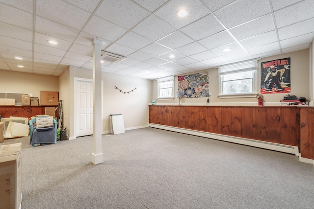 basement with baseboards, carpet, baseboard heating, a paneled ceiling, and recessed lighting