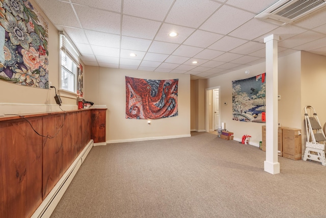 basement featuring recessed lighting, visible vents, baseboards, baseboard heating, and carpet