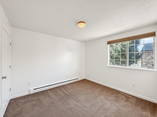 carpeted empty room featuring baseboards, baseboard heating, and a textured ceiling