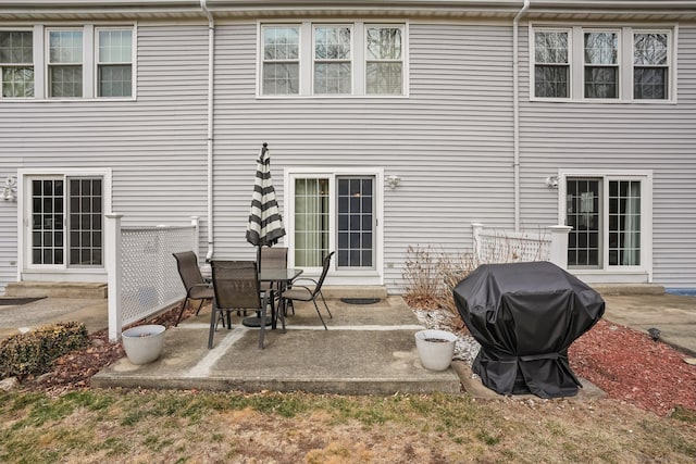 rear view of property featuring a patio area