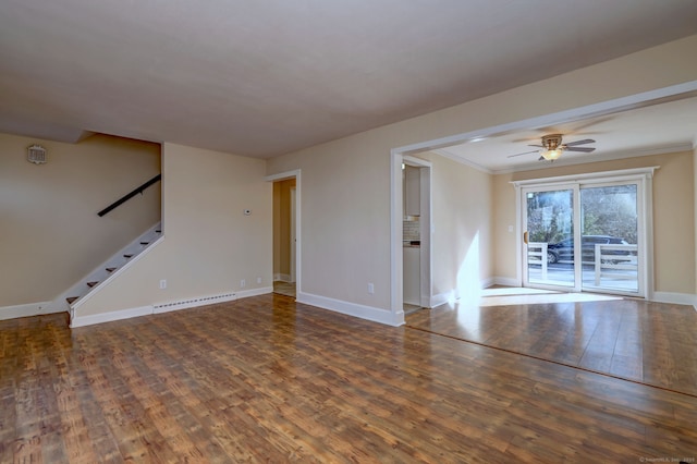 unfurnished living room featuring baseboards, stairs, baseboard heating, hardwood / wood-style flooring, and a ceiling fan