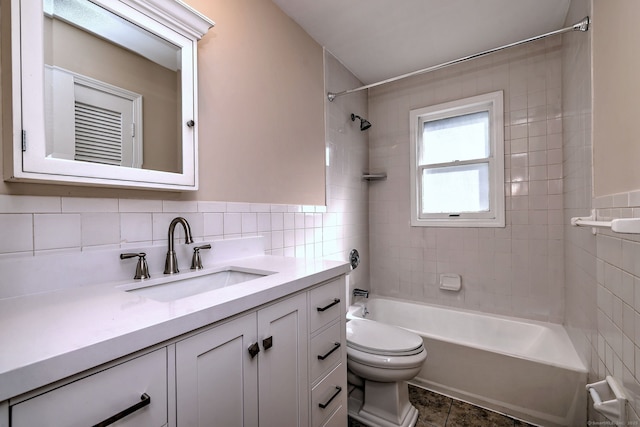 bathroom featuring shower / bathtub combination, toilet, tile walls, and vanity