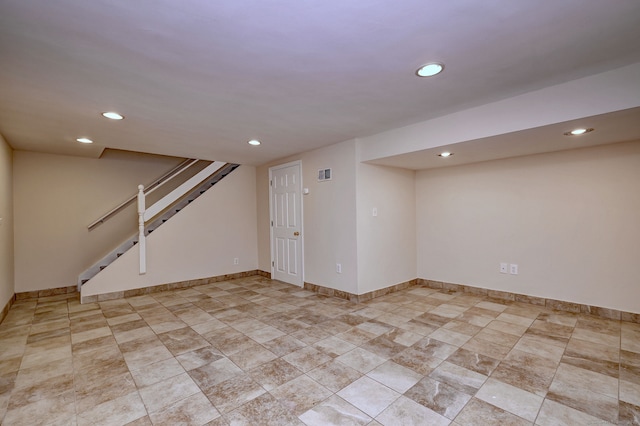 finished below grade area with recessed lighting, stairway, baseboards, and visible vents