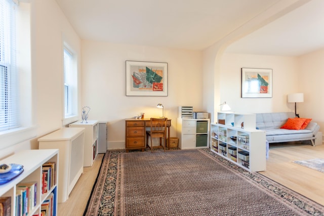 sitting room with light wood-style floors and baseboards