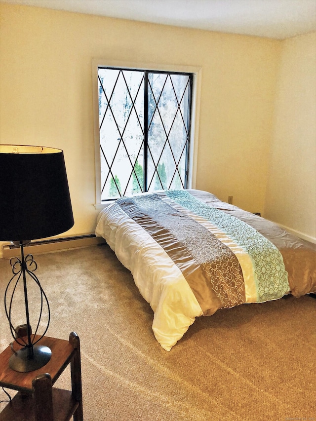 carpeted bedroom with baseboards