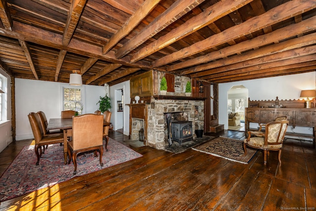 175 Mountain Rd, Wilton, CT 06897 - dining space with a wood ceiling with exposed beams, wood-type flooring, a wood stove, and arched walkways