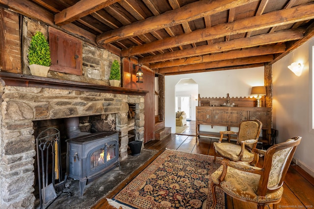 175 Mountain Rd, Wilton, CT 06897 - living area with a wooden ceiling with exposed beams, a wood stove, arched walkways, and wood finished floors