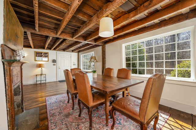 175 Mountain Rd, Wilton, CT 06897 - dining area featuring wood ceiling with exposed beams, healthy amount of natural light, baseboards, and wood-type flooring