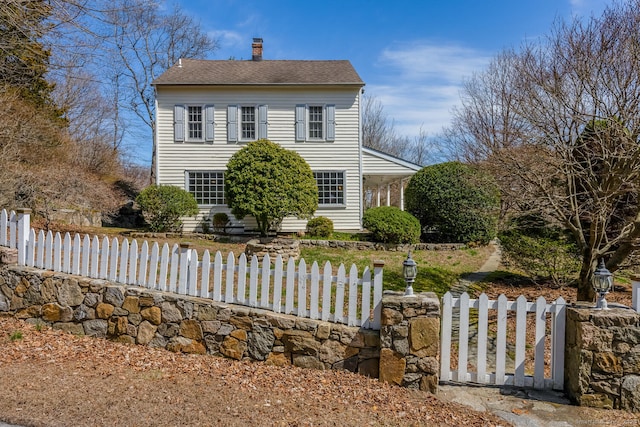 175 Mountain Rd, Wilton, CT 06897 - view of front facade featuring a fenced front yard and a chimney