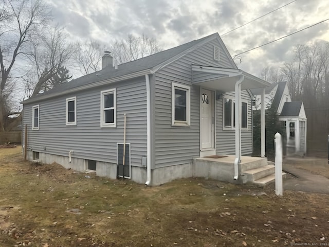 view of home's exterior featuring a chimney