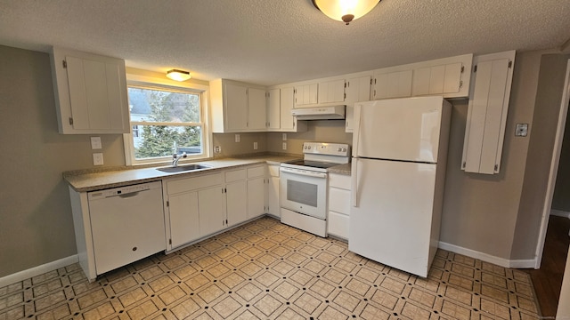 kitchen featuring white appliances, baseboards, light floors, under cabinet range hood, and a sink