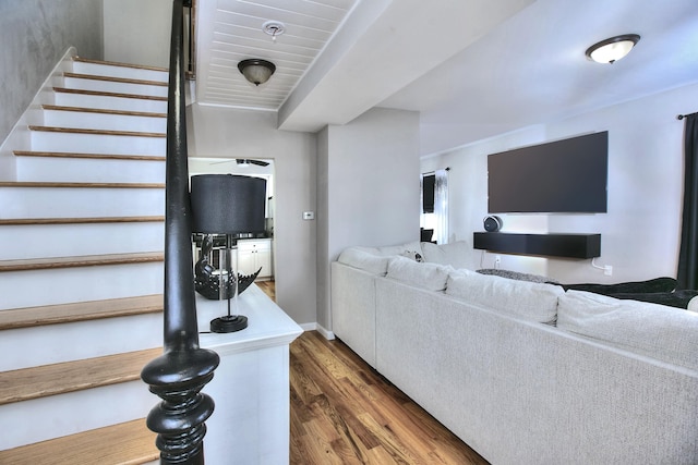 living room featuring stairway and wood finished floors