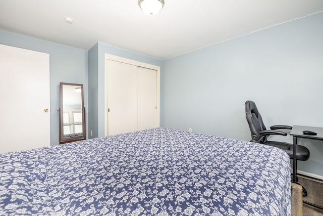 bedroom with a closet and wood finished floors