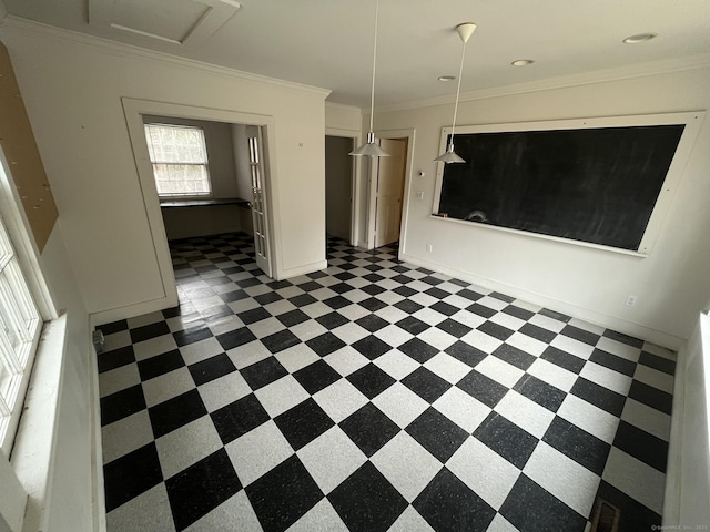 interior space featuring baseboards and ornamental molding