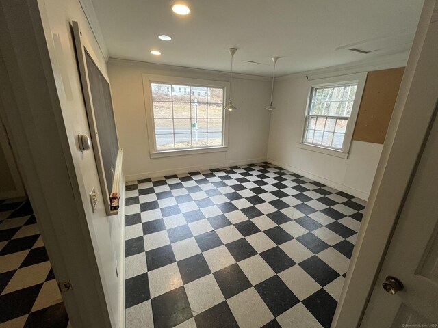 unfurnished room with baseboards, recessed lighting, and crown molding