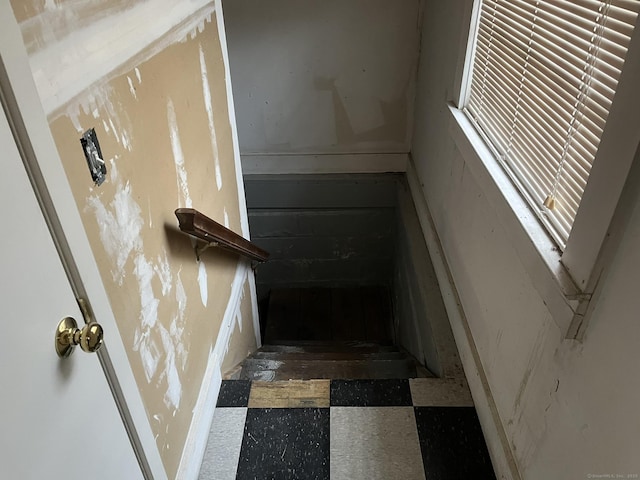 stairway featuring tile patterned floors