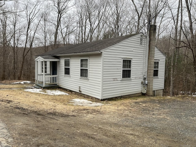 exterior space featuring a chimney