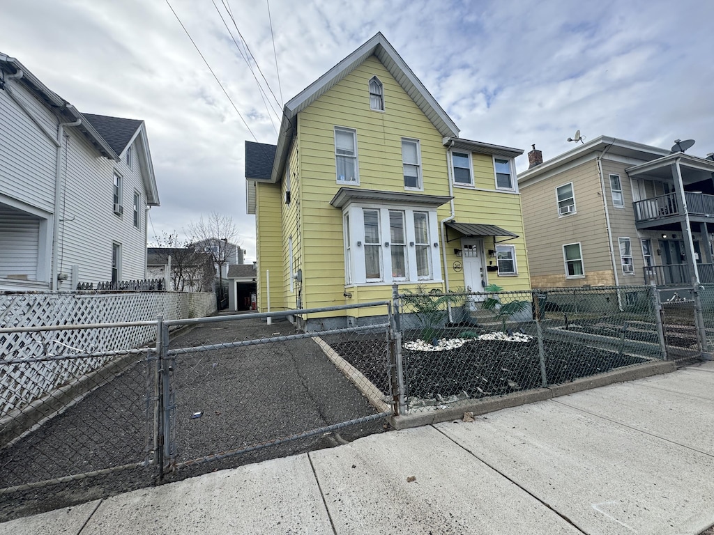 view of front of home with a gate and a fenced front yard